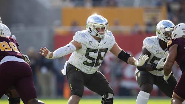 Nov 18, 2023; Tempe, Arizona, USA; Oregon Ducks offensive lineman Jackson Powers-Johnson (58) against the Arizona State Sun Devils at Mountain America Stadium. Mandatory Credit: Mark J. Rebilas-USA TODAY Sports  